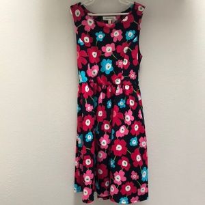 Colorful cocktail dress with open back design